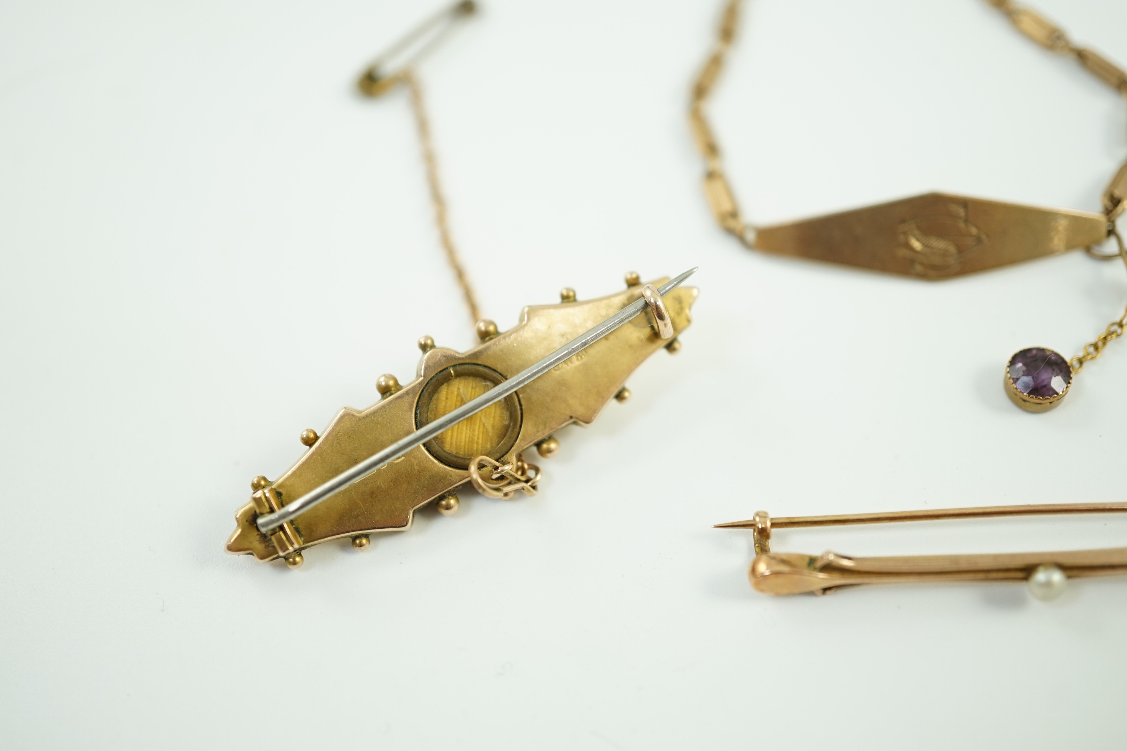 Two early 20th century yellow metal brooches including 9ct and diamond chip set and a seed pearl set bar brooch by Murrle Bennett & Co?, together with a 9ct identity bracelet, gross weight 10.6 grams.